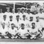 Baker, back row far right, on board D