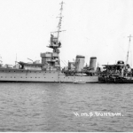 Portside view with boats alongside - probably pre-war