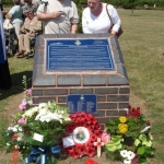 Members of DunSoc examining the Dunedin Memorial